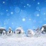 silver balls on snow with snowfall - blue heaven